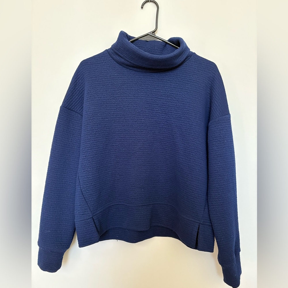 Calia by Carrie Underwood blue turtleneck style sweater.
